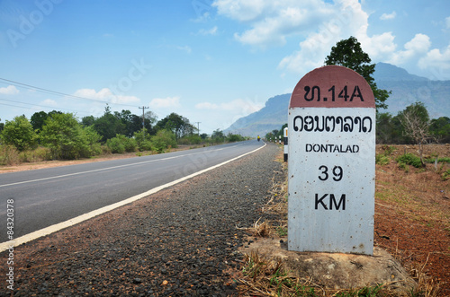 Fotografering Milestone go to Dontalad at Pakse in Champasak, Laos