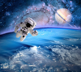 Wall Mural - astronaut spaceman planet saturn
