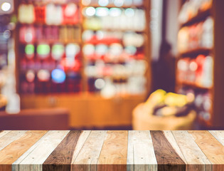 Poster - Empty wood table and blurred cafe light background. product disp