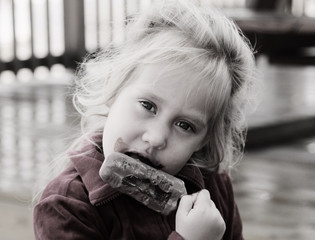 cute 4 years old girl eating ice cream