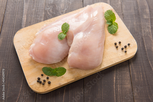 Fotografía Raw chicken breast fillets on wooden background