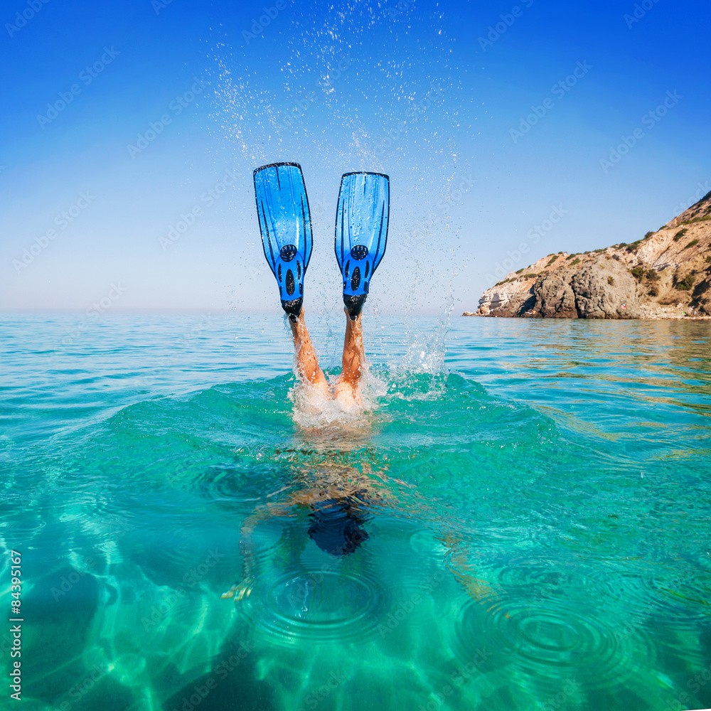 Diving. Women snorkeling in flippers beach islands. Girl dives - obrazy, fototapety, plakaty 