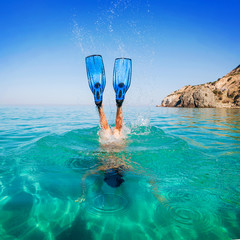 Diving. Women snorkeling in flippers beach islands. Girl dives