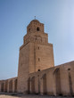 Tower of the Great Mosque in Kairouan against a blue sky