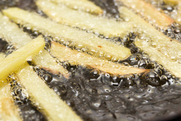 Canvas Print - French fries fried in a pan