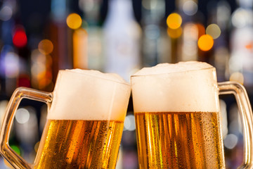 Jugs of beer served on bar counter