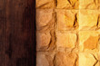 yellow stone wall with wooden stripe