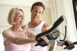 © Monkey Business - Senior Woman On Exercise Bike With Trainer