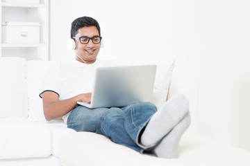 Canvas Print - Indian guy listening to music