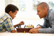 Father Playing Chess With Son