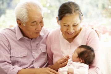 Wall Mural - Asian grandparents with baby