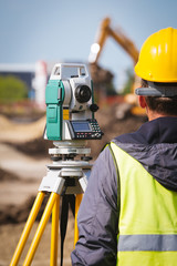 Surveyor engineer worker making measuring with theodolite tool equipment at construction site