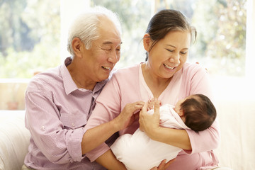 Wall Mural - Asian grandparents with baby