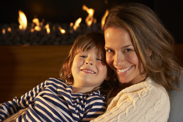 Wall Mural - Portrait mother and son by firelight