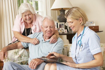 Wall Mural - Retired Senior Man Having Health Check With Nurse At Home