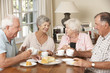 © Monkey Business - Group Of Senior Couples Enjoying Afternoon Tea Together At Home
