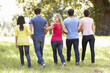© Monkey Business - Group Of Young Friends Walking Through Countryside