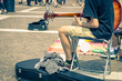 street performer plays his guitar - art and music concept