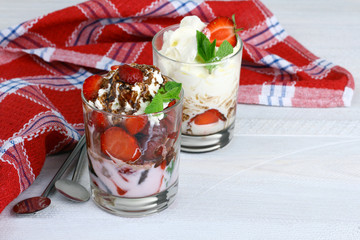 Poster - Healthy layered  desserts with fresh strawberries and cream on wooden 