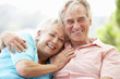 © Monkey Business - Senior Couple Sitting On Outdoor Seat Together