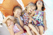© Monkey Business - Four Children Relaxing In Garden Hammock Together