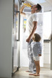 © Monkey Business - Father And Son Raiding The Fridge For Drink