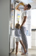 © Monkey Business - Father And Son Raiding The Fridge For Drink