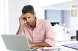 © Monkey Business - Stressed Man Working At Laptop In Home Office