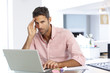 © Monkey Business - Stressed Man Working At Laptop In Home Office