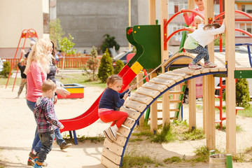 Wall Mural - Children at the playground 