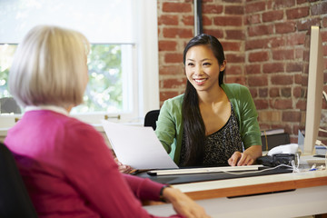 Wall Mural - Businesswoman Interviewing Female Job Applicant In Office