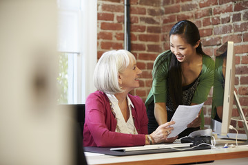 Wall Mural - Two Businesswomen Meeting In Creative Office