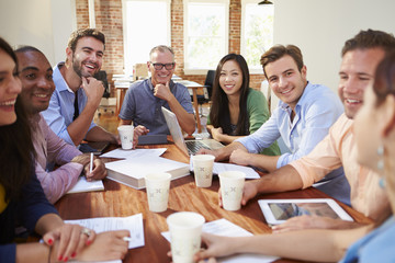 Wall Mural - Group Of Office Workers Meeting To Discuss Ideas