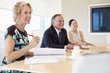 © Monkey Business - Three Businesspeople Having Meeting In Boardroom