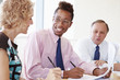© Monkey Business - Three Businesspeople Having Meeting In Boardroom