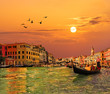 Venice Grand canal, gondolas and Rialto Bridge at sunset, Italy