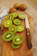 Mature juicy a kiwi on a wooden board