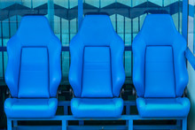 Empty Coach And Reserves Blue Bench On A Football Stadium