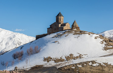 Poster - 14th century Holy Trinity Church (Tsminda Sameba) near Mount Kazbek in Georgia