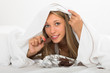 © JackF - Woman eating chocolate in bed