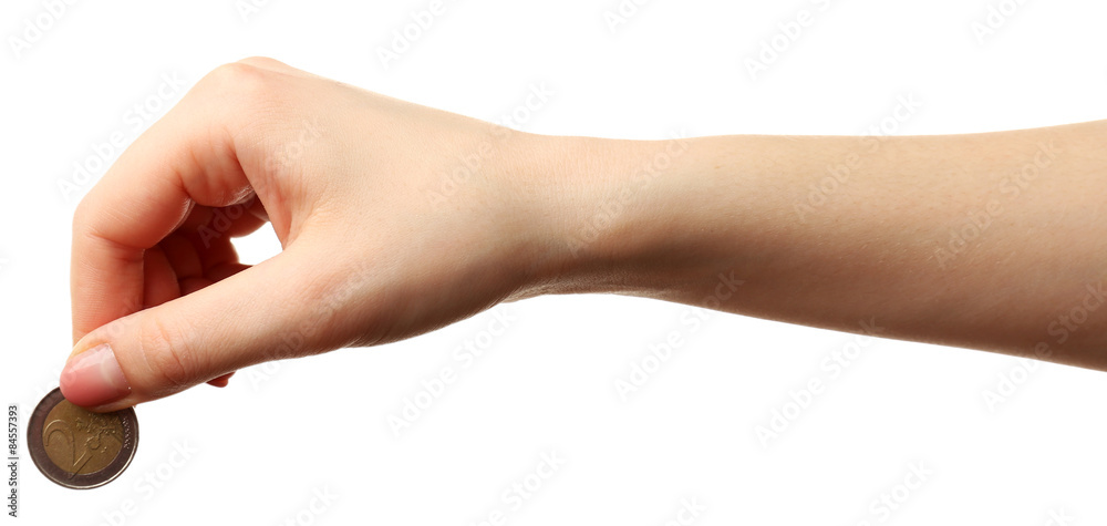 Female hand with coin isolated on white