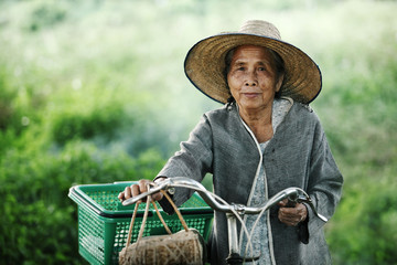 Old women couple with their bikes outdoors