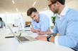 © goodluz - Businessmen in work meeting with laptop computer