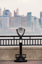 Binoculars And New York City Manhattan Skyline In The Background
