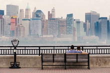 NEW YORK CITY - MAY, 2015: Couple Relaxing In Front Of Manhattan
