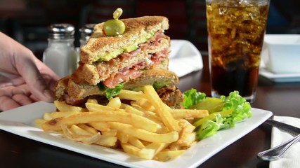 Canvas Print - Serving a BLT sandwich in a restaurant
