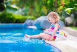 Fototapeta  - Little girl in swimming pool