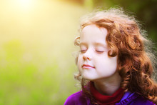 Little Girl Closed Her Eyes And Breathes The Fresh Air In The Pa