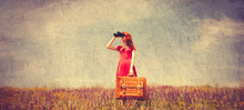 Girl In Red Dress With Suitcase And Binocular