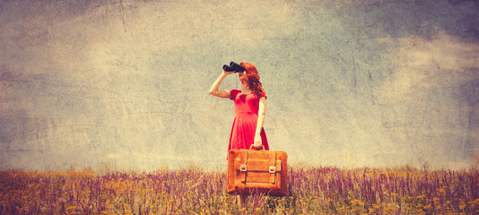  girl in red dress with suitcase and binocular